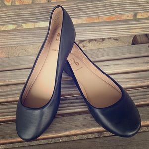 Black leather flats